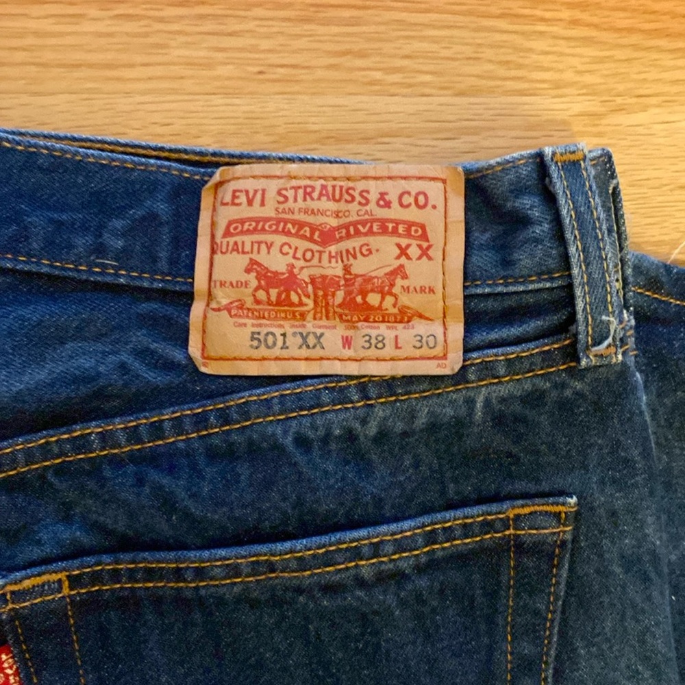 Levi’s 501xx states 38x 30 but r shrink to fit. Measures 36” waste x 27” in